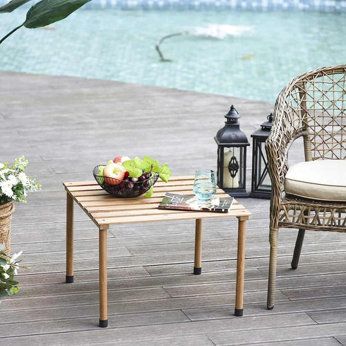 Petite table de jardin en bois pliante sur une terrasse - photo 2