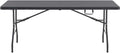 Table de jardin pliante 8 personnes en PEHD 183 x 76 cm installée dans un jardin