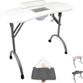Table de manucure pliante avec aspirateur intégré dans un salon d'onglerie