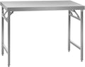 Table pliante en acier inoxydable de 120 x 60 cm dans une cuisine professionnelle