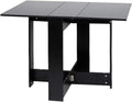 Table pliante noire de 103 cm dépliée dans un séjour