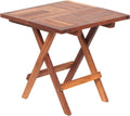 Table pliante en teck massif de 50 x 50 cm sur une terrasse